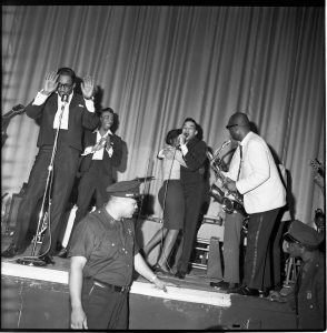 The Miracles light up the night during a show in the early 1960s. Motown Records Archives. Courtesy of the EMI Archive Trust and Universal Music Group. 